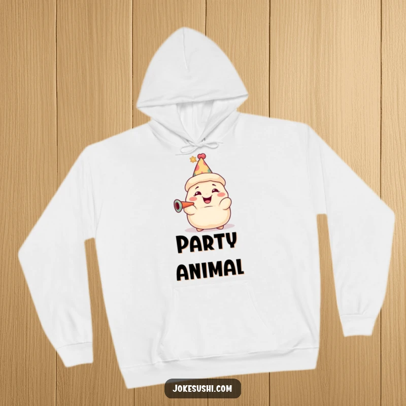 Funny dumpling hoodie featuring a grinning character with a party hat, blowing a horn in celebration. Cozy and humorous wear.